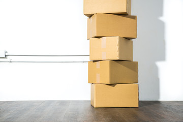 Pile of cardboard boxes on white background with box shadow
