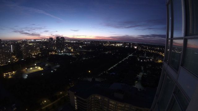 Sunrise from Highrise 1. Sunrise as seen from a highrise condominium building. Shot in wide angle time lapse. Rendered in UltraHD 4K from high resolution stills.