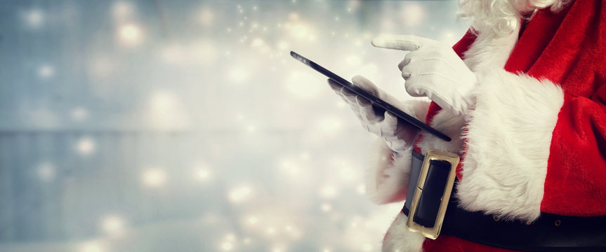Santa Claus using a tablet