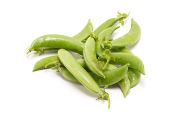 Heap of green peas isolated on white.
