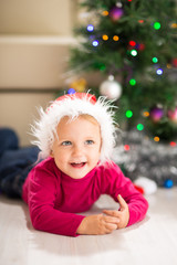 Baby near Christmas tree