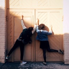 funny couple is holding hands 