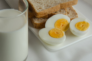 Easy Breakfast with Whole Grain Bread, Boiled Egg and Milk.