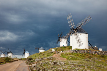Old  windmills on dramatic sky and rainy weather