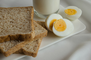 Easy Breakfast with Whole Grain Bread, Boiled Egg and Milk.