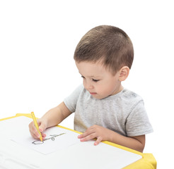Boy drawing with pencil isolated on the white background