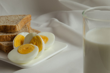Easy Breakfast with Whole Grain Bread, Boiled Egg and Milk.