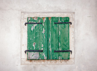 retro window with wooden shutters and stone walls