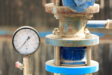Manometer near old pipe