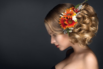 Beautiful woman portrait with autumn flowers in hair - 94315764