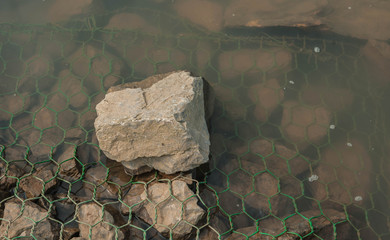 Barrier to erosion from flooding.