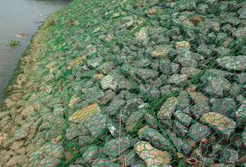 Barrier to erosion from flooding.