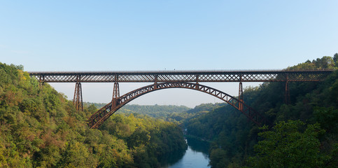 Iron bridge over the river Adda Lecco Italy