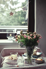 Beautiful romantic tea time settings with candles and roses