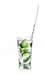 Fresh cocktail with lime slices isolated on white background