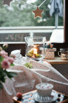 Romantic room settings with candles, glass vases and other decor