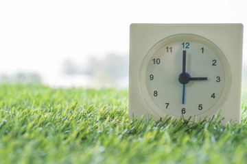 Time is Three o'clock in the evening, clock on artificial green