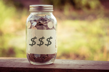 save money for investment concept money in the glass with filter effect retro vintage style