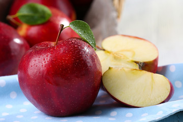 Ripe red apples on table close up