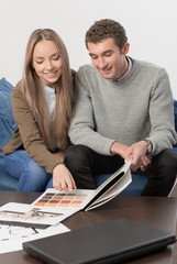 Couple selects house color from samples