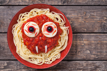 Scary halloween food pasta vampire monster face with big eyes