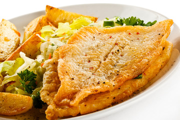 Fish dish - fried fish fillets and vegetables 