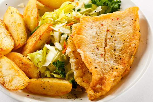 Fish dish - fried fish fillets and vegetables 