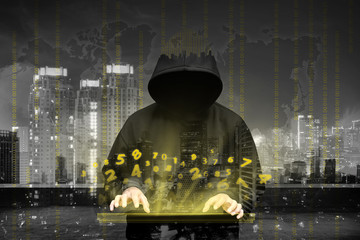 Computer hacker silhouette of hooded man
