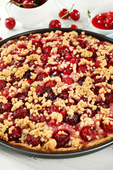 Tasty homemade pie with cherries on table close up