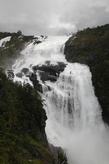 Waterfall in Husedalen valley in Hardangervidda national park, Norway