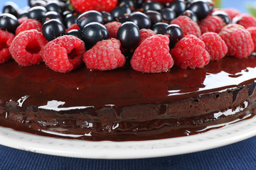 Delicious chocolate cake with summer berries, closeup
