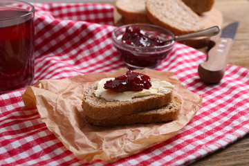 Fresh toast with butter and jam on table close up