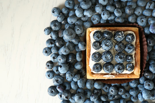 Gourmet fresh blueberry tart on table
