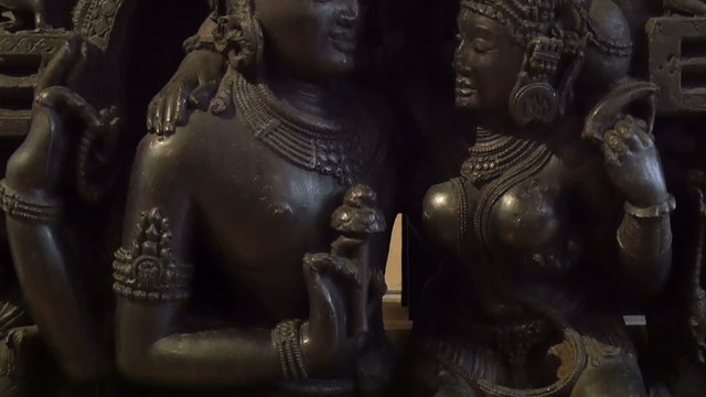 Statue of two buddhas image. A man and a woman that looks like a buddha