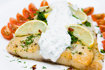 grilled fish with vegetables and cream sauce
