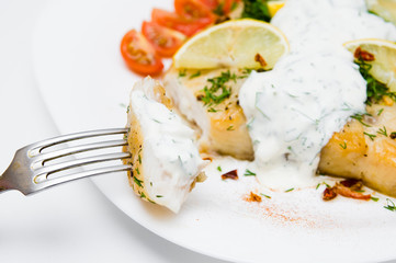 grilled fish with vegetables and cream sauce