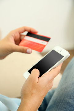 Female using mobile banking, close up