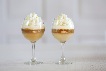 Wine glass with jelly on light background