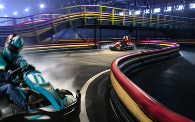 Two cart racers are racing on the grand track
