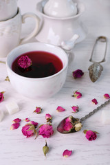 Obraz na płótnie Canvas Tea set and rose tea on table