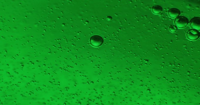 Bubbles in color jello cream (gel soap). Extrime macro 4k