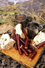 Grilled sausages on cutting board in the wood