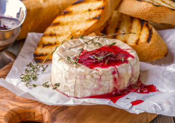 Camembert with berry jam, toast and thyme.