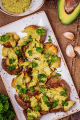 Baked potatoes served with guacamole