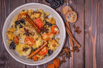 Traditional moroccan chicken with dried fruits and spices.