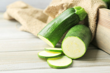 Fresh zucchini on wooden background