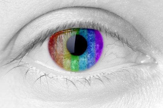 rainbow colours in a woman eye