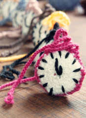 Fototapeta na wymiar knitted clock, colorful watch, handmade hobby