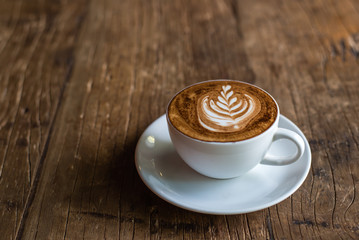 Latte Art on Wooden Background
