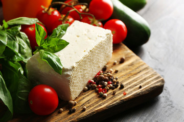 Fresh ingredients for preparing zucchini rolls on wooden background